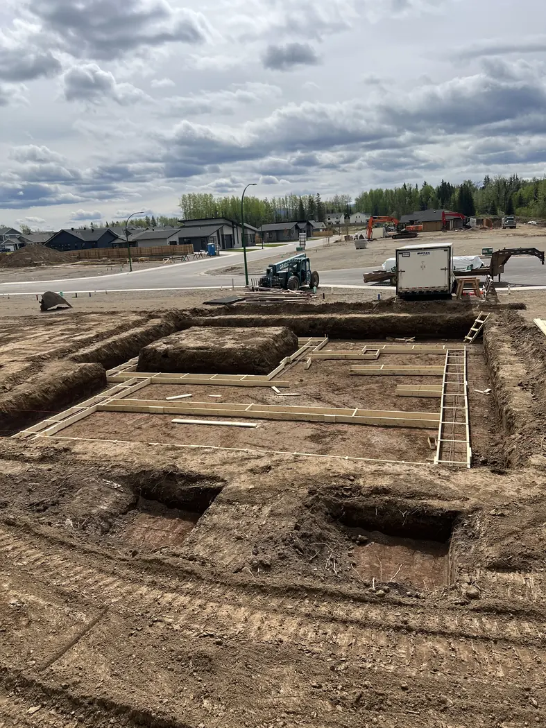 Formed and staked footings dug square and level on a new house pad